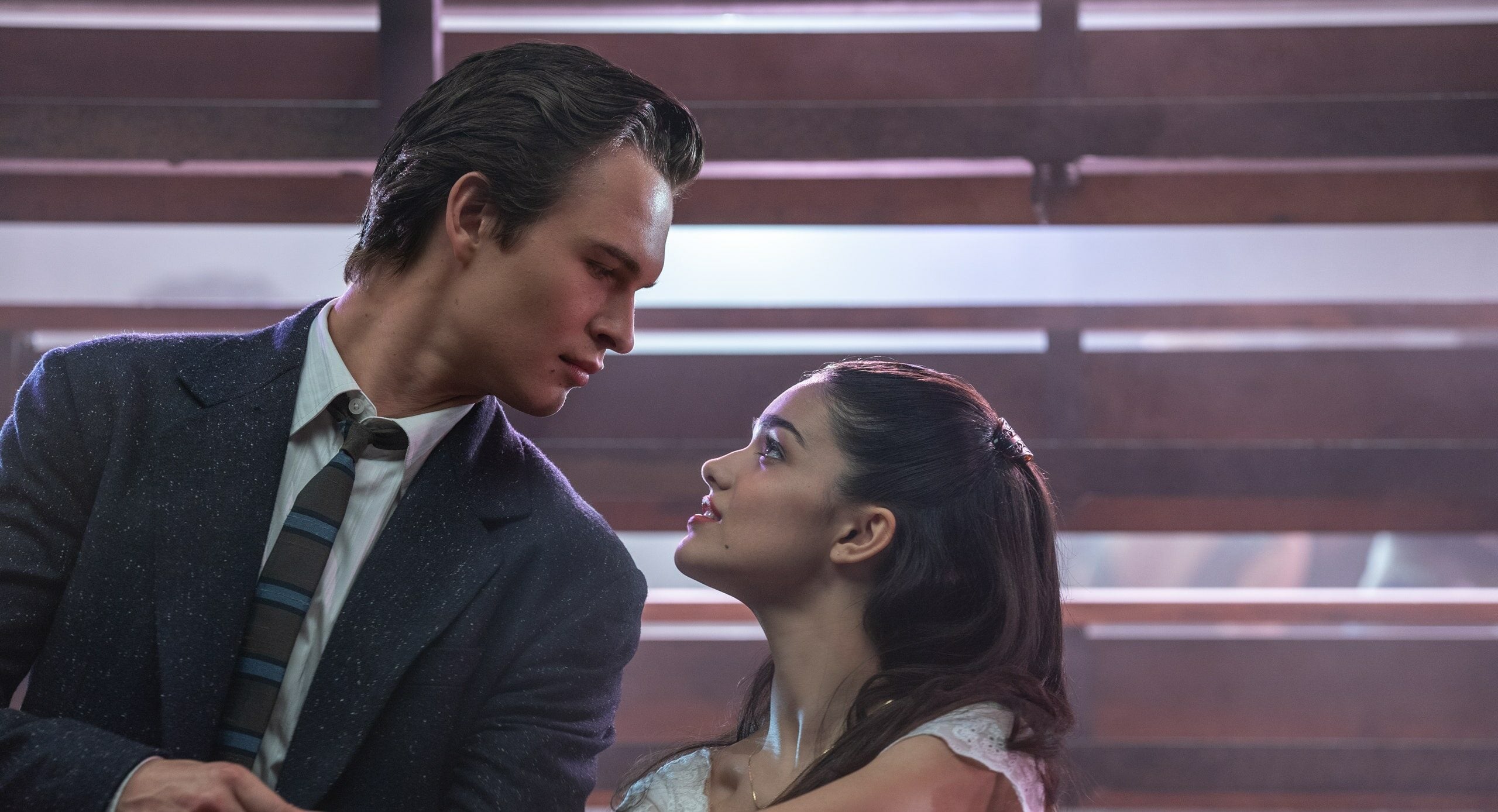 ansel elgort (left) and rachel zegler (right) dancing in west side story