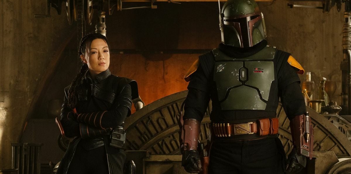 ming-na wen (left) and temuera morrison (right) with jabba's throne in the book of boba fett