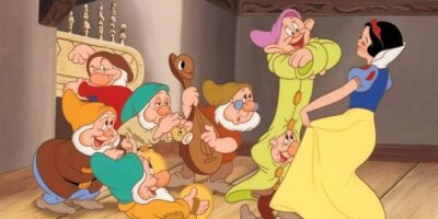 snow white and seven dwarfs dancing in cottage