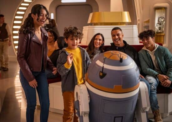 A group of people looking at a robot