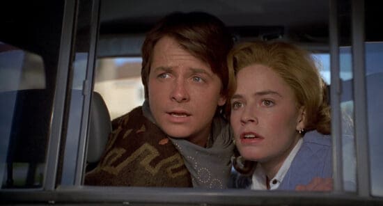 Michael J Fox as Marty McFly (L) and Jennifer Shue as Jennifer Parker (R) in Back to the Future Part III