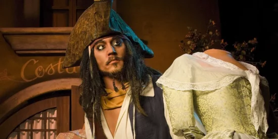 Jack Sparrow animatronic looking at a woman animatronic.