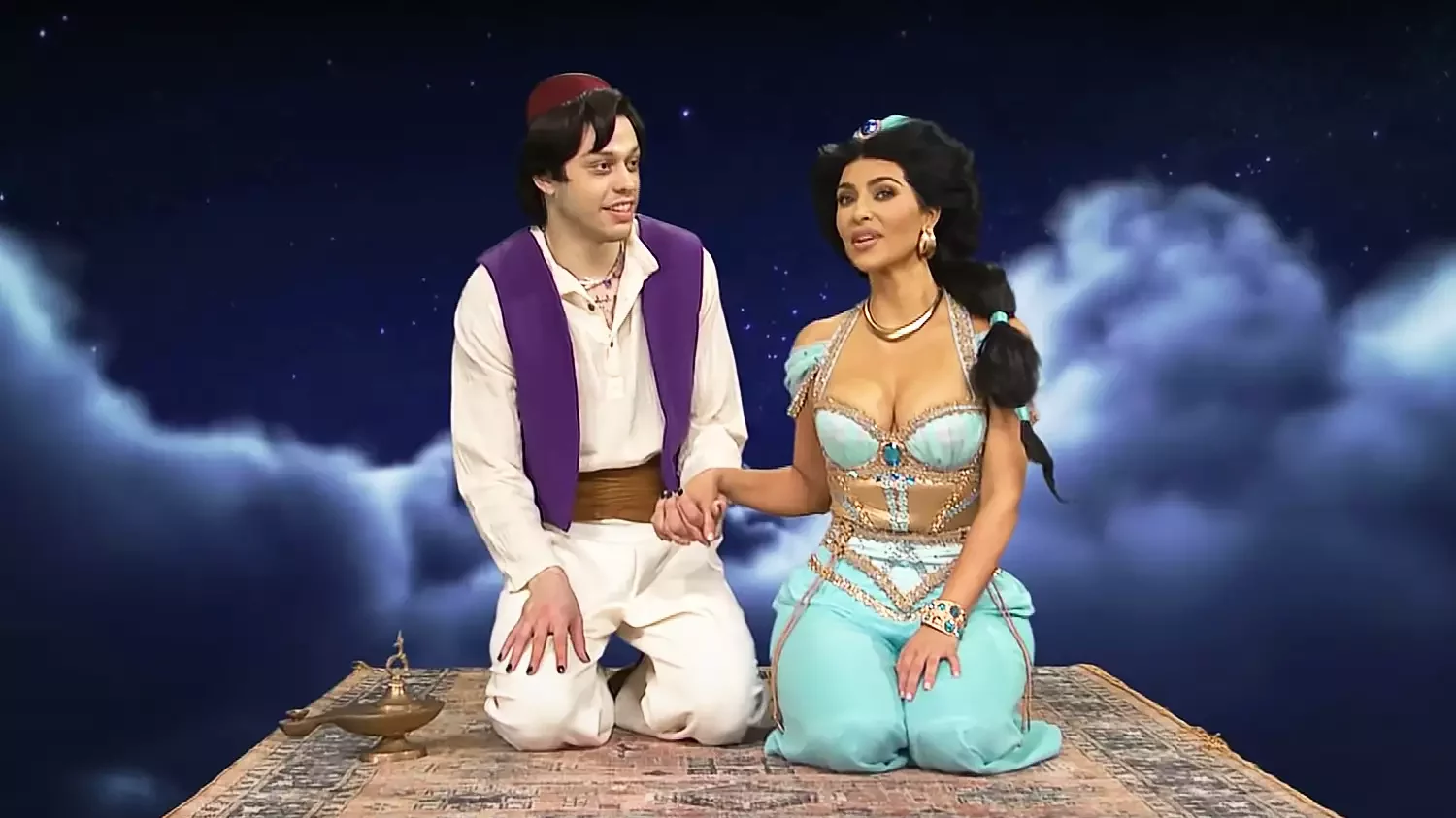 pete davidson (left) and kim kardashian (right) on magic carpet during aladdin and jasmine saturday night live skit