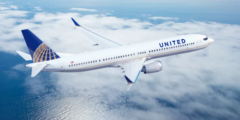 united airlines plane flying over water