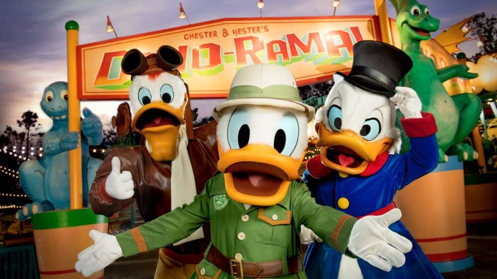 dino-rama sign with donald duck and scrooge mcduck
