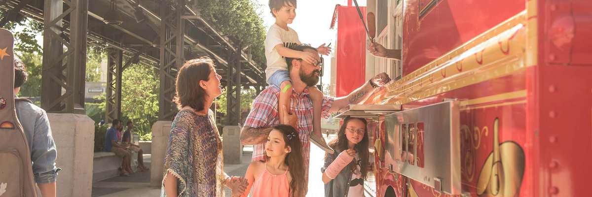 family at walt disney world resort food cart