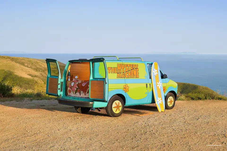 scooby doo mystery machine on hill overlooking pacific ocean