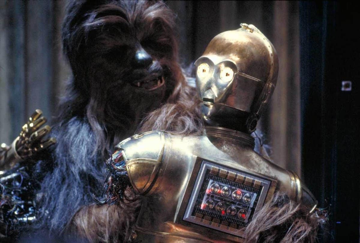 Chewbacca carrying C-3PO