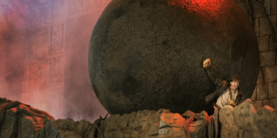 Indiana Jones runs from a boulder in Indiana Jones Epic Stunt Spectacular!