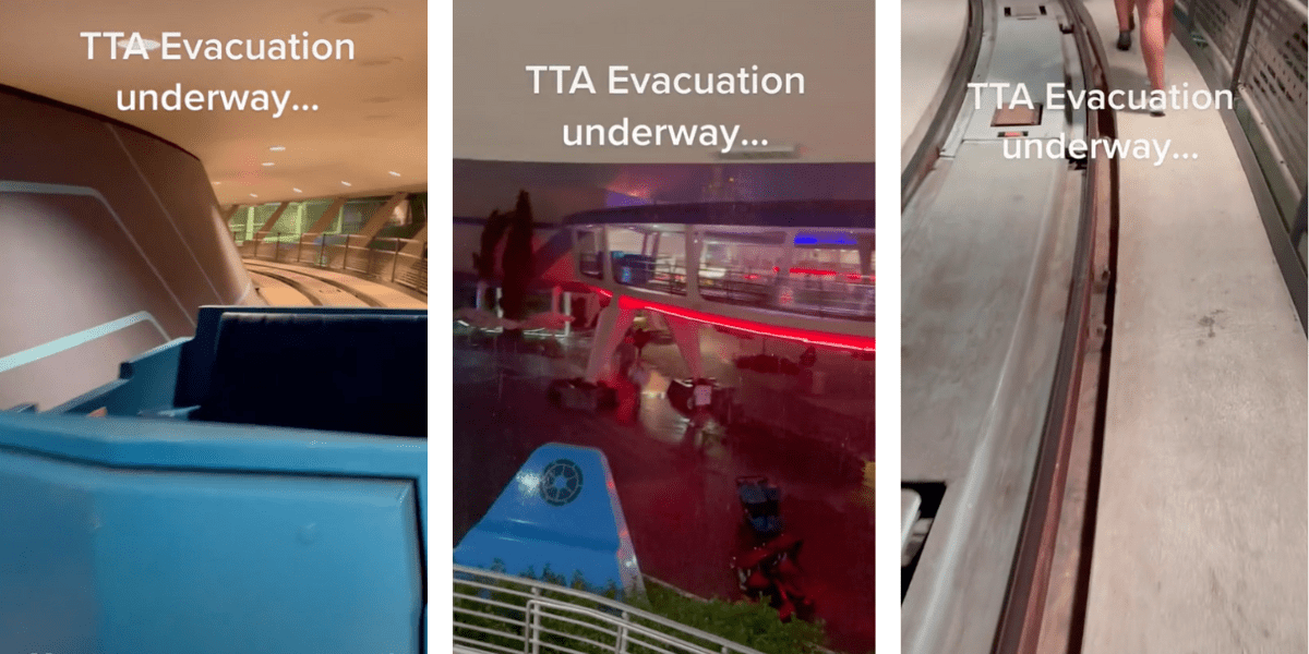 Guests walk down the tracks of the PeopleMover while it pours rain and lightning.