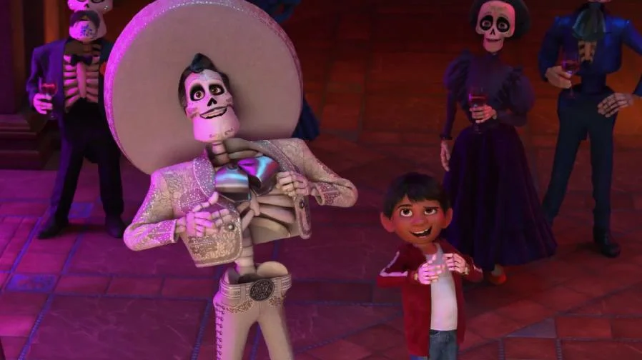 ernesto de la cruz (left) from coco and miguel (right)