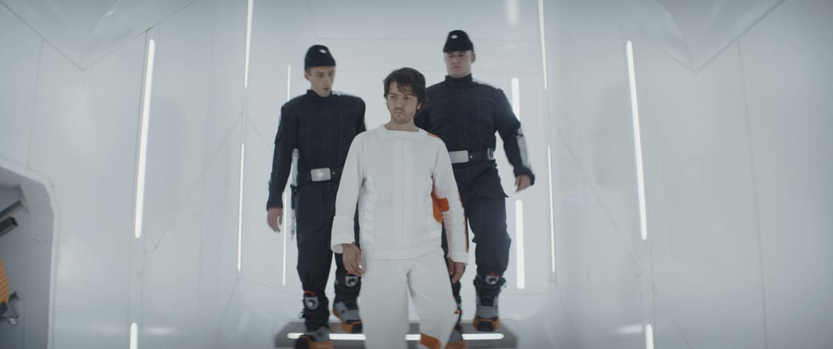 (Center): Cassian Andor (Diego Luna) with delivery guards (Kenny Fullwood and Josh Herdman) in Lucasfilm's ANDOR