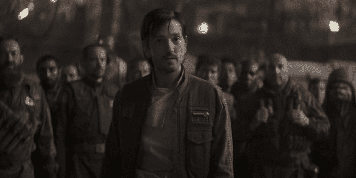 Cassian Andor with Rebel Pathfinders talking to Jyn