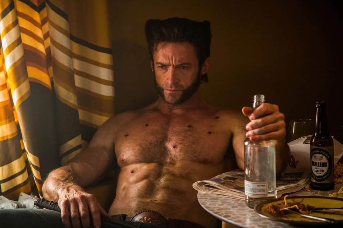 Hugh Jackman as Wolverine holding alcohol
