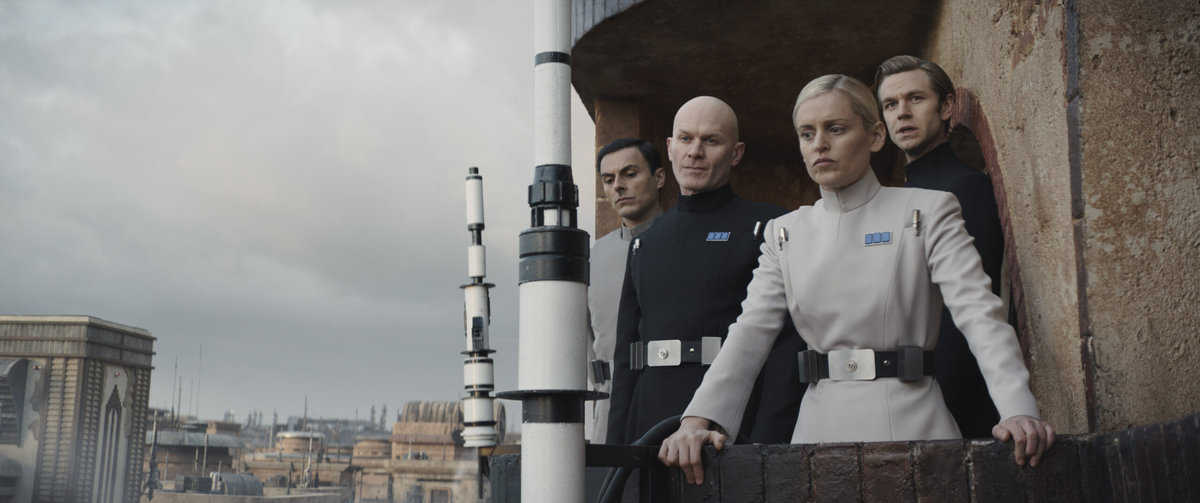 (L-R): Corv (Noof Ousellam), Lieutenant Keysax (Nick Moss), Supervisor Dedra Meero (Denise Gough) and Captain Vanis Tigo (Wilf Scolding) in Lucasfilm's ANDOR, exclusively on Disney+. ©2022 Lucasfilm Ltd. & TM. All Rights Reserved.