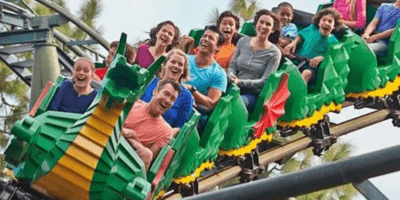 Guests riding the dragon coaster at legoland