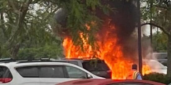 A photo of a fire in the parking lot of Disney World's Polynesian Village Resort. 