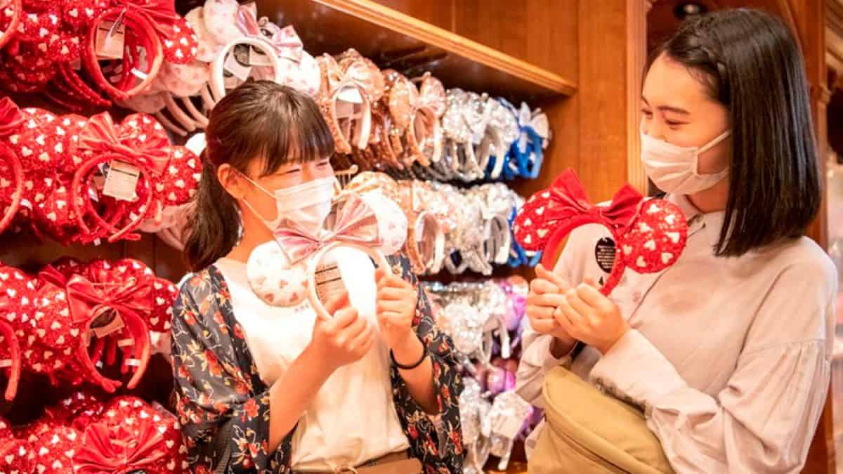 Two female Guests shopping for Minnie Ears at Tokyo Disneyland