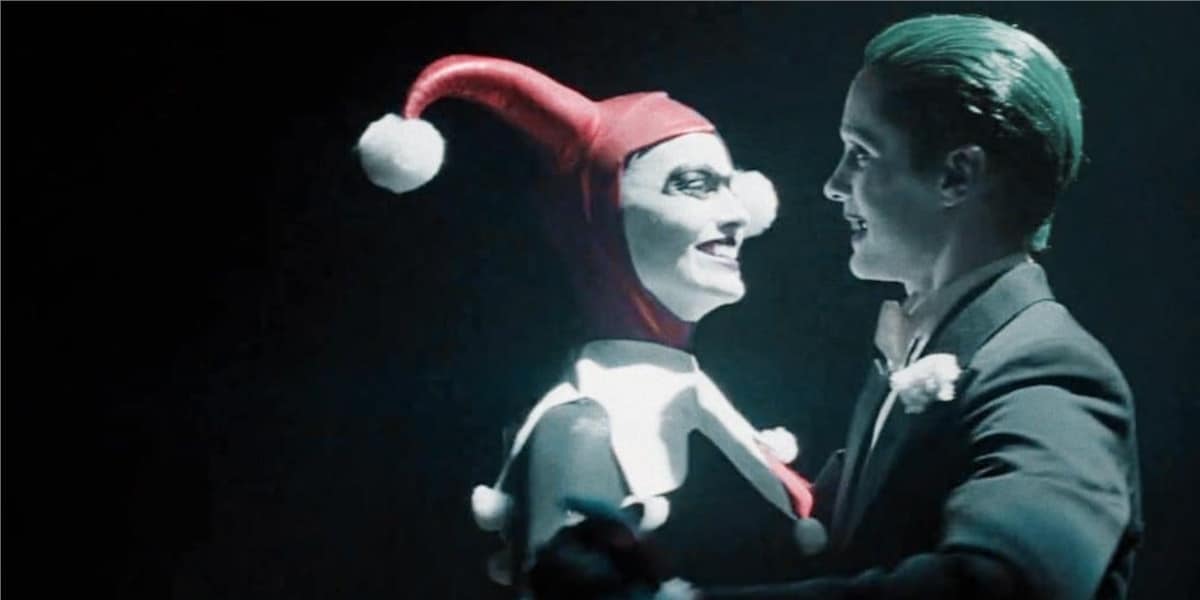 Harley Quinn and Joker dancing in the spotlight