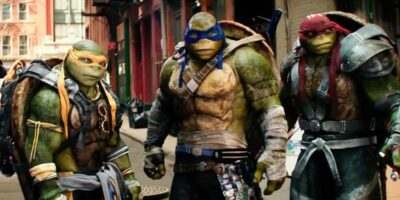 Michelangelo, Leonardo, and Raphael revealing themselves to the police in 'Teenage Mutant Ninja Turtles Out of the Shadows'