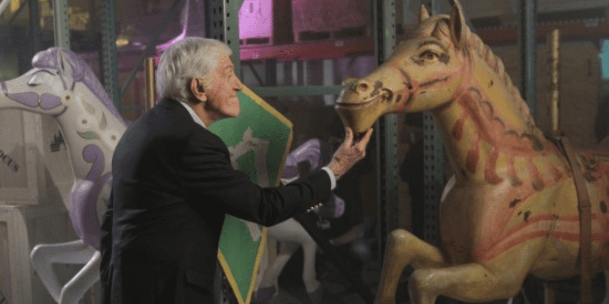 Dick Van Dyke with a carousel horse from Mary Poppins