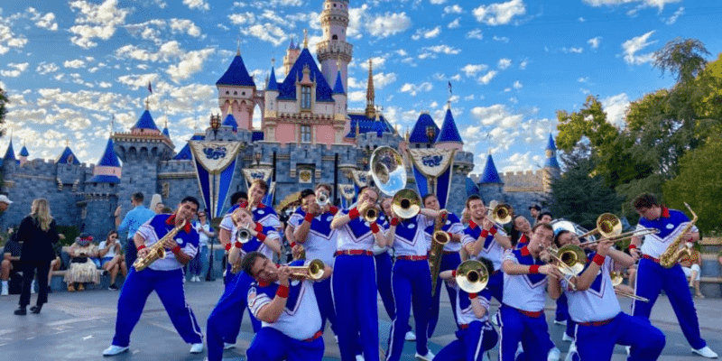 The Disneyland Resort All-American College Band performing in front of Sleeping Beauty Castle in the heart of Disneyland Park