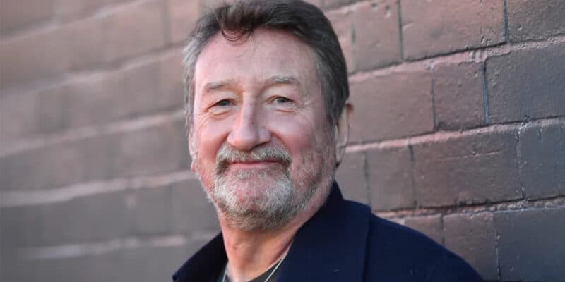 Steven Knight in front of a brick wall