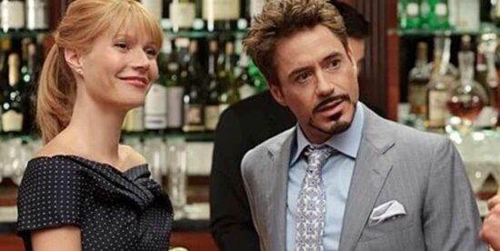 Pepper Potts and Tony Stark talking to someone
