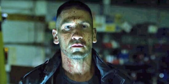 Frank Castle/The Punisher staring intensely with blood on his face.