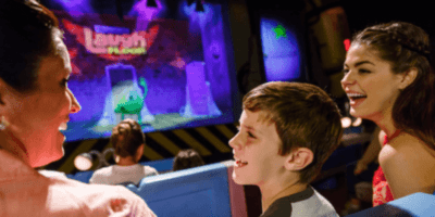 Three Guests laugh at Mike Wasowski on the Monsters Inc, Laugh Floor.