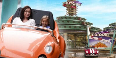 Woman with a girl riding on a Disney attraction, Autopia station at Disney World, on the background