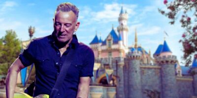 Bruce Springsteen playing guitar over Sleeping Beauty Castle at Disneyland