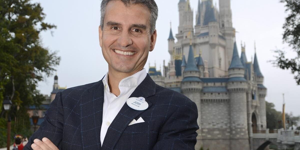 Josh D'Amaro in front of Cinderella Castle