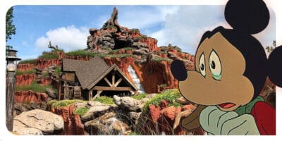 Mickey Christmas Carol crying, Splash Mountain Attraction on the background