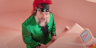 Jack Black at a piano in Bowser-inspired garb Peaches from The Super Mario Bros. Movie