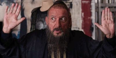 Ben Kingsley as Trevor Slattery putting his hands up in Iron Man 3