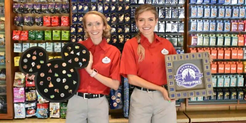 Disney World Cast Members hold pin boards
