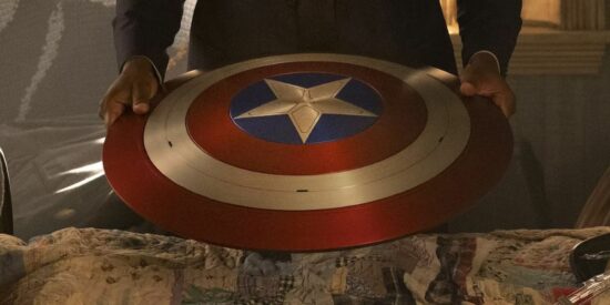Anthony Mackie holding onto Captain America's shield in Falcon and the Winter Soldier