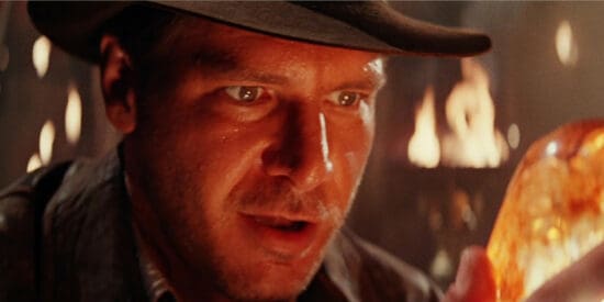 Harrison Ford as Indiana Jones, looking at the Sankara Stones in Indiana Jones and the Temple of Doom