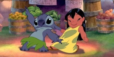 Lilo dances with Stitch wearing a hula skirt