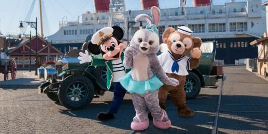 Mickey, Duffy, and StellaLou in front of a car and boat