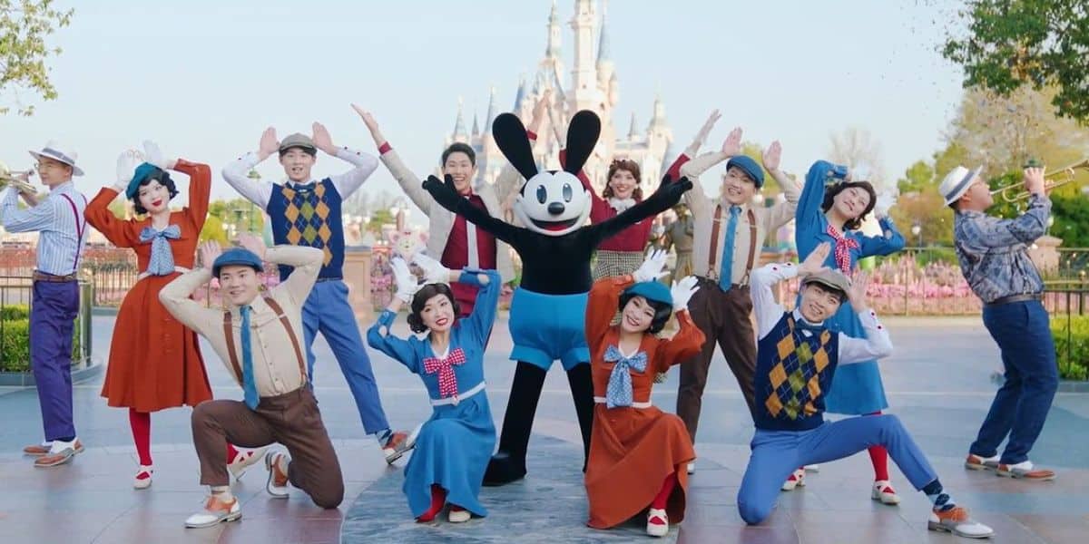 Oswald poses in front of the castle with other performers