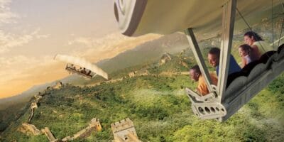 Riders smile while flying over the Great Wall of China on Soarin'