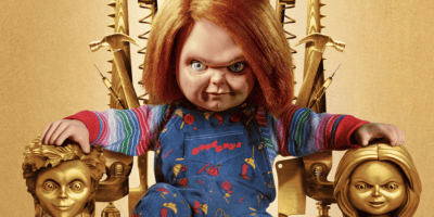 Chucky sitting on a golden throne