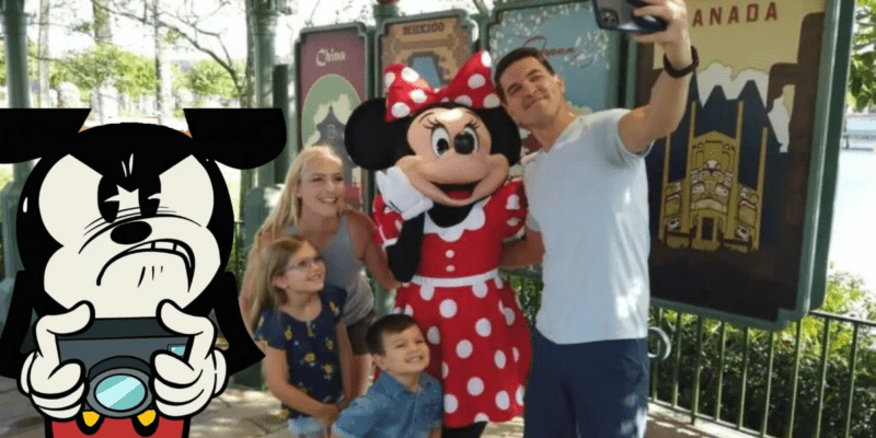 Mickey Mouse upset, promoting Disney bans against mobile phones with a family taking pictures with Minnie Mouse