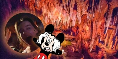 Shocked Mickey Mouse looking at girl in the circle, Disney Attraction as a background