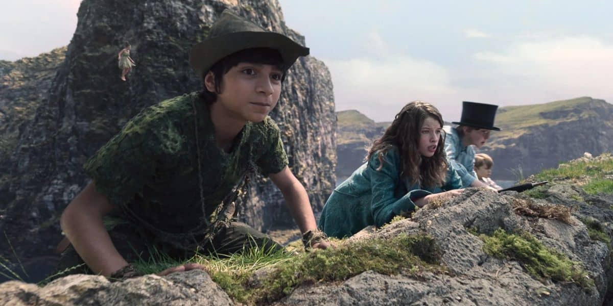 Peter, Wendy, John, and Michael look over the rocks