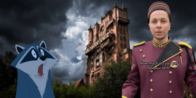 A Disney Cast Member standing in front of Tower of Terror, Meeko from 'Pocahontas' looking shocked.