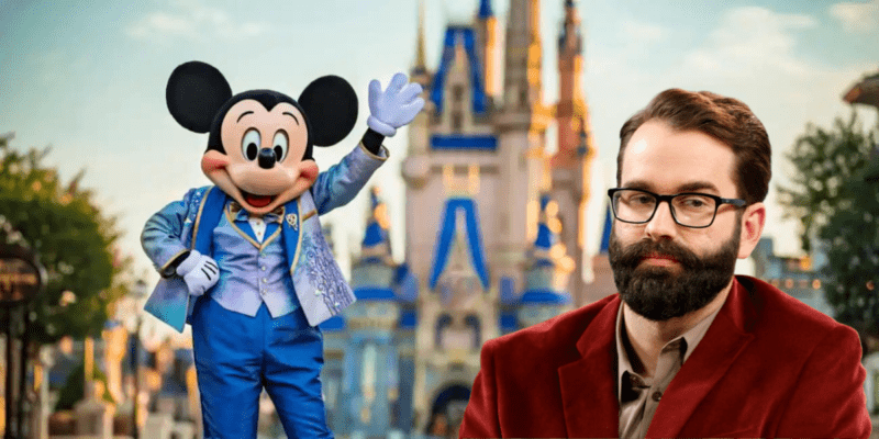 Matt Walsh in a red jacket, photoshopped onto a picture of Mickey Mouse waving in front of Cinderella Castle at Disney World.