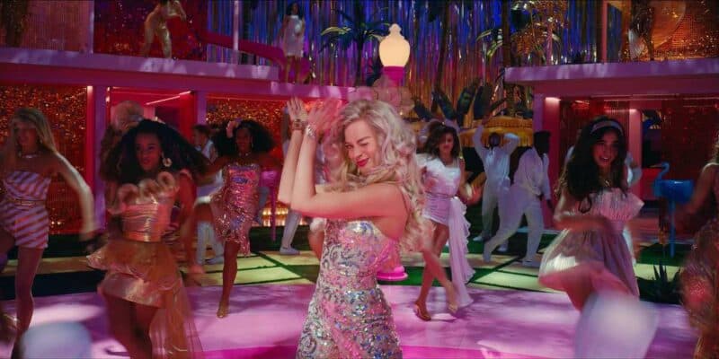 all of the barbies from the barbie movie dance together margot robbie in front